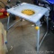 Specialty metal table has wheels on top edge as pictures. Stands 19