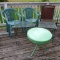 Cute metal side table, woven patio chair, wrought metal side tables, and a couple other chairs. A