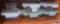 Six Glaslock containers, five with lids. Largest measures 6