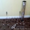 Curtain rod and some over-the-door clothes or towel hooks. Widest is 19