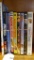 Eight DVDs and a book including Forrest Gump, Alvin and the Chipmunks, Spaceballs, Dennis the
