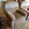 Comfortable rocking recliner matches Lot 795. Nice neutral colors. Some stains or dirt, hopefully