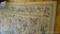Floral patterned area rug is about 11' x 8' and in decent condition.