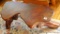 Wonderful slab wood coffee table with tree trunk feet. Measures 45