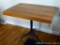 Casters have been added to this table with an antique cast iron base. Table top measures 3' x 27