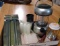 Camping supplies including lights, candles and tent stakes.