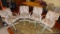 Four upholstered rolling kitchen chairs are sturdy and in overall good condition.