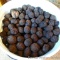 5 gallon bucket of black walnuts.