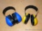 Peltor ear protection muffs. Blue pair is marked Peltor Bull's Eye Ultimate 10, yellow pair is