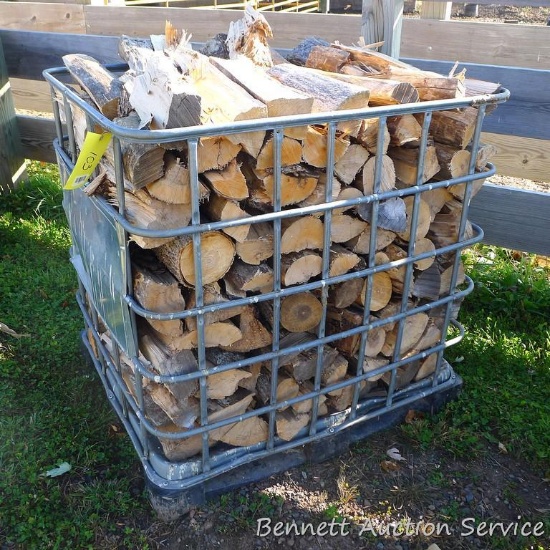 Metal crate filled with mixed firewood. Crate measures approx. 40" x 46" x 45".