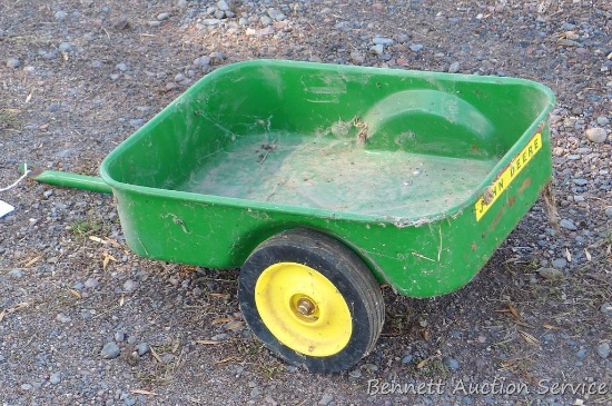 Cute little metal John Deere child's trailer is about 15" x 29" long overall. Small amount of rust