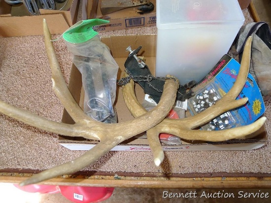 Fire starters, blaze orange streamer, rattling antlers, bow holder, more. Antlers are about 14"