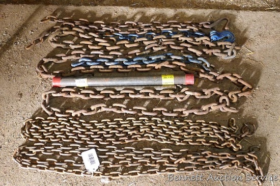 Several sections of chain; Longest is 10'. Lot also has 18" long section of 1" pipe and 2 springs.