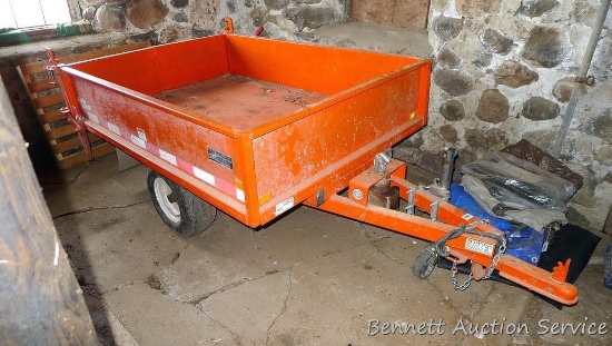 Large utility trailer with hand pump hydraulic dump is of all steel construction. Box is 53" x 74" x