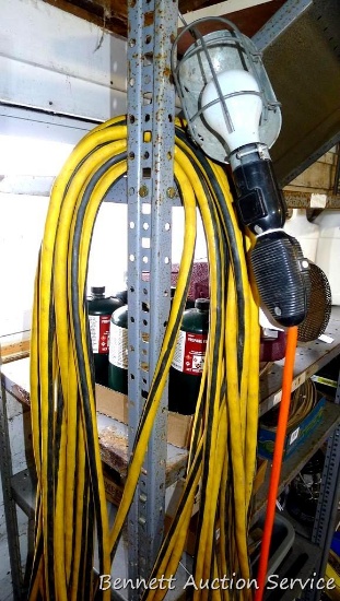 Heavy duty extension cord approx. 100' long; trouble light may need new light bulb.