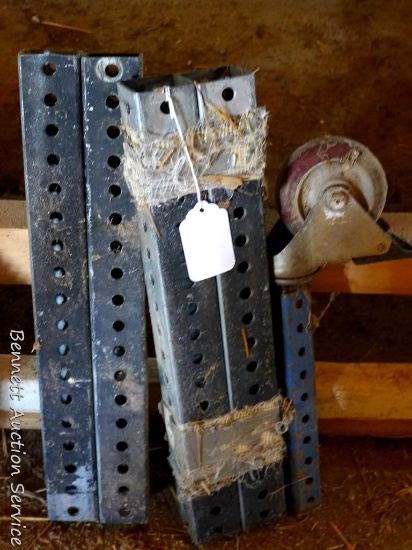 Four 18" worktable leg extensions, plus a 10" piece with a 4" caster on it.