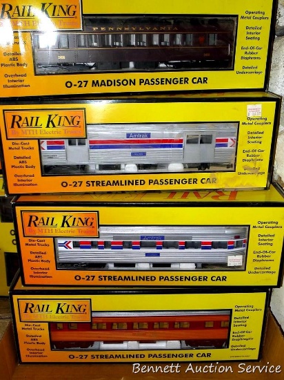 Four Rail King model trains with original boxes. All trains look to be in good condition, boxes are