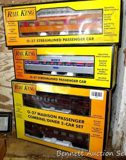 Four Rail King model trains with original boxes. All trains look to be in good condition, boxes are