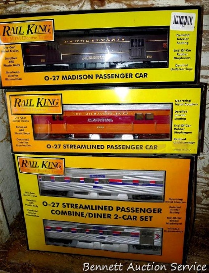 Four Rail King model trains with original boxes. All trains look to be in good condition, boxes are