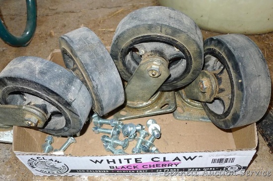 Four 6" swiveling casters with appropriate hardware. Wheels show some wear and are 2" wide. Nice