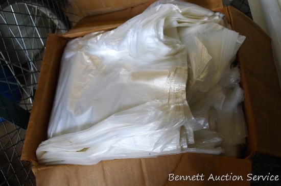 Box full of 24" x 24" trash bags. Box is hand marked "HD bags, 500/ case". Box is 13" x 15" x 7"