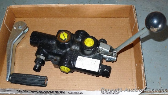 Hydraulic cylinder valve assembly; handle for a jack.