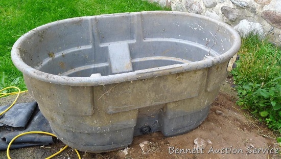 Rubbermaid Agricultural Products stock tank is about 52" x 38" x 24" high. Bottom is marked "4245".