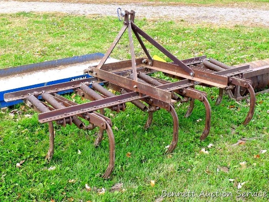 Three-point spring loaded cultivator/chisel plow has category 3 pins and measures 86" wide x