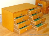 Eight drawer cabinet has felt lined drawers. Cabinet measures 16