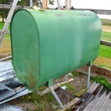 265 gallon fuel oil barrel had been inside until the shed fell down. Front legs are bent, but easily