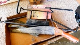 Buck Wing bow holder with arrow tube, gambrel hook, brush saw, more. Hook is 24