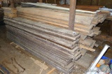 Huge pile of assorted wooden siding and various lumber up to 10