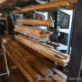 Please come earlier to pick up this lumber on and in front of shelving unit to free it up.