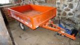 Large utility trailer with hand pump hydraulic dump is of all steel construction. Box is 53