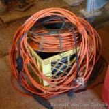 Crate of extension cords includes a cord reel, and five cords. Heavy duty extension cord, coil is