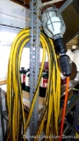 Heavy duty extension cord approx. 100' long; trouble light may need new light bulb.