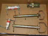 Two hydraulic cylinder pins; hydraulic quick coupler; 2 hitch pins, largest is 7/8