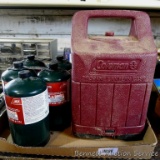 No shipping. Five 16 oz. propane fuel canisters; Coleman lantern case is 8