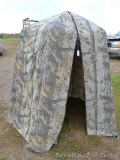Realtree pattern folding hunting blind. Worn spots and a couple of small tears noted, in otherwise