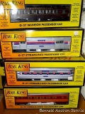 Four Rail King model trains with original boxes. All trains look to be in good condition, boxes are