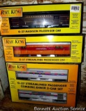 Four Rail King model trains with original boxes. All trains look to be in good condition, boxes are