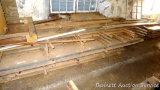 Assortment of boards and lumber as pictured. Longer pieces around 16