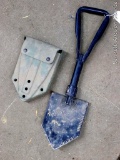Folding military shovel is marked 
