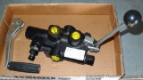 Hydraulic cylinder valve assembly; handle for a jack.