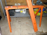 Pair of folding metal sawhorses have 38