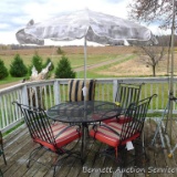 Patio table, four rocking chairs, cushions and umbrella. Table is 48