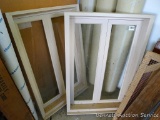 Two wooden windows; measures 24