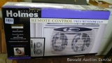 Holmes remote control twin window fan also has a manual touch pad. Looks to be NIB. Fits virtually