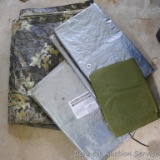 Cabela's and other tarps, four in all. NIP 6' x 8' tarp is UV resistant. Camo tarp is about 110
