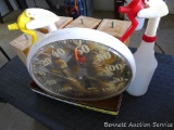 Bird themed outdoor thermometer, table leg, and a couple of spray bottles. Thermometer is 12-1/2